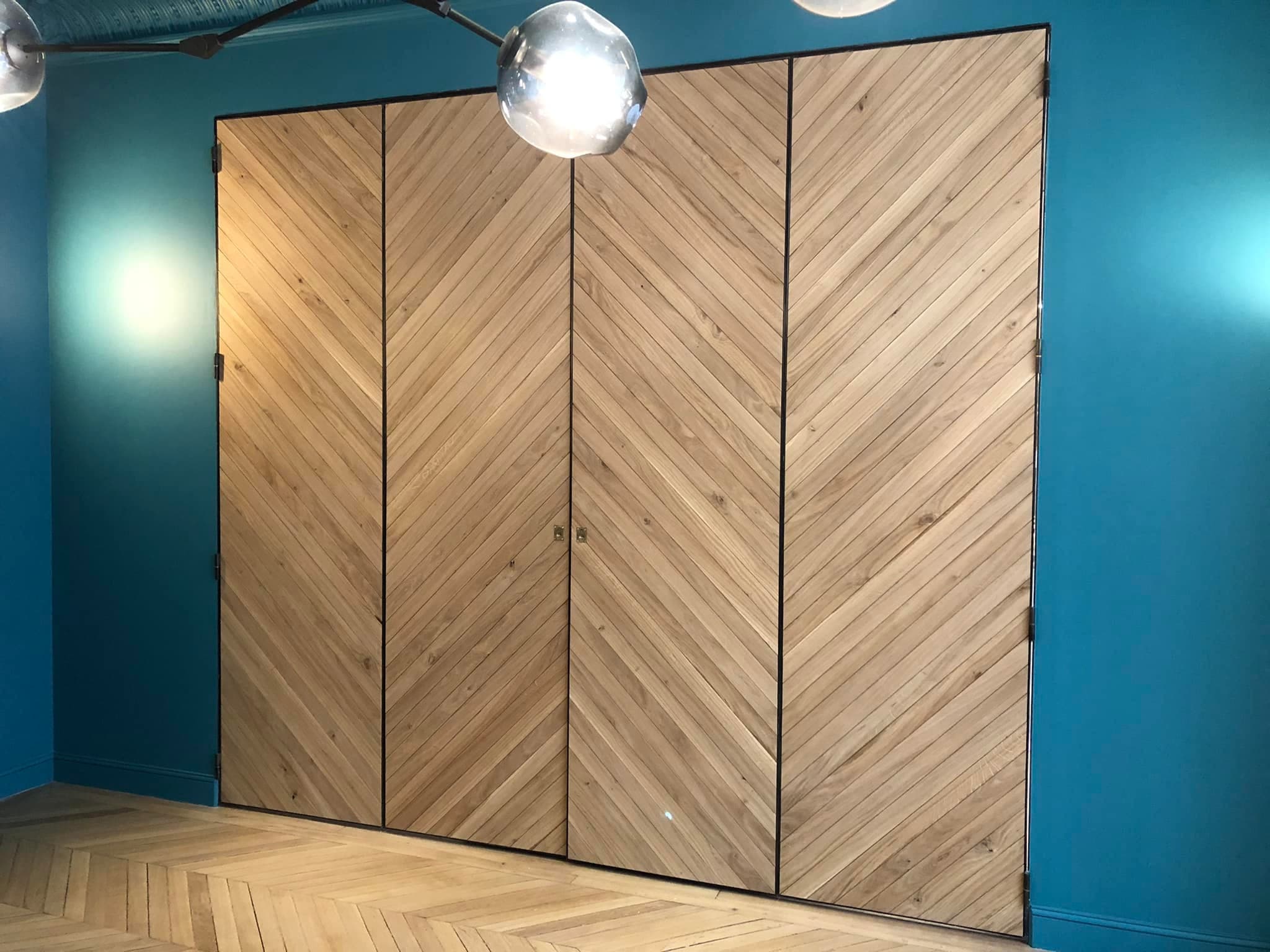 Séparation de pièce structure métallique lames chêne pliant par Menuiserie Charron